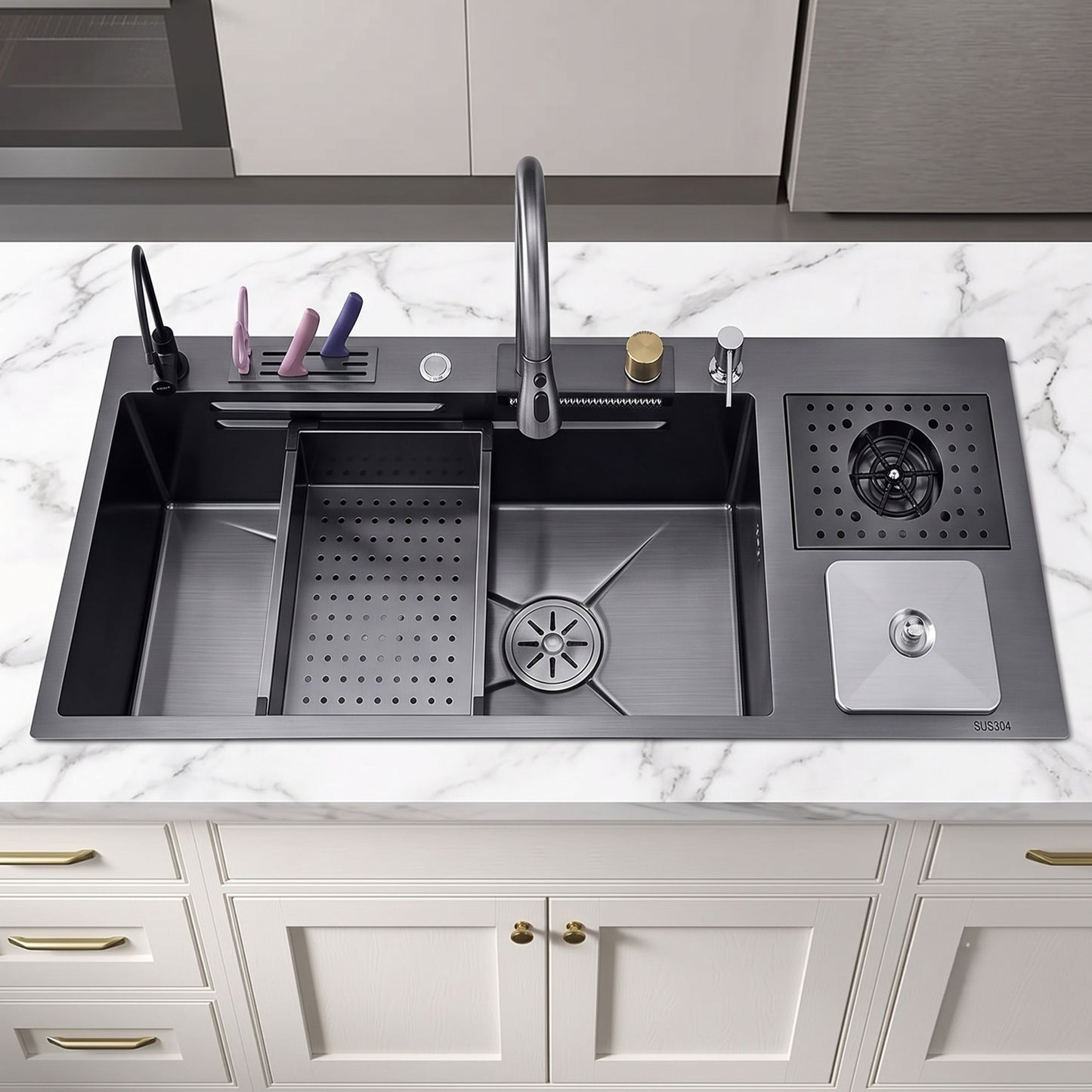 A dark gray double-bowl kitchen sink with a faucet, drain basket, and side storage tray, installed on a white marble countertop above white cabinets.