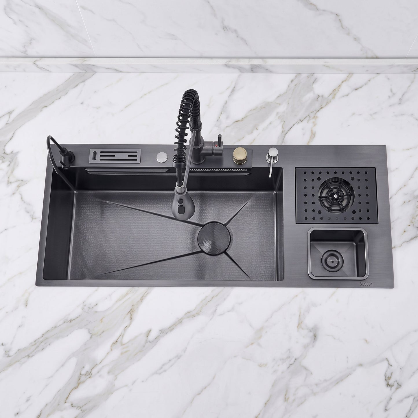 A matte black kitchen sink with a matching pull-down faucet, drain basket, and small storage compartment, shown installed on a white marble countertop.