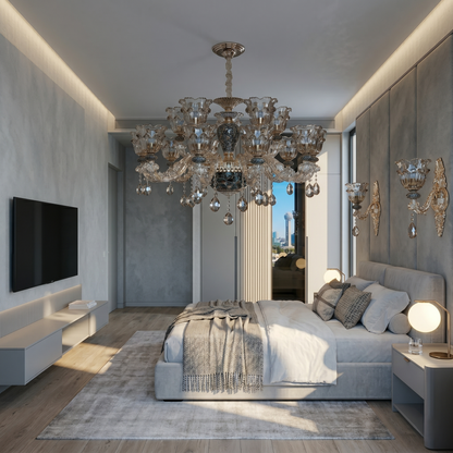Luxurious bedroom with a chandelier, bed, and city view