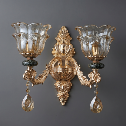 Decorative wall sconce with gold and crystal design on a gray background
