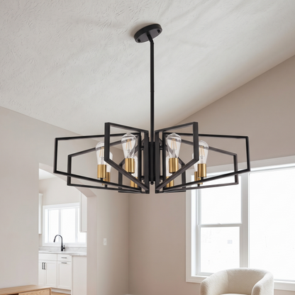 Modern black chandelier hanging in a room with neutral walls and a window.