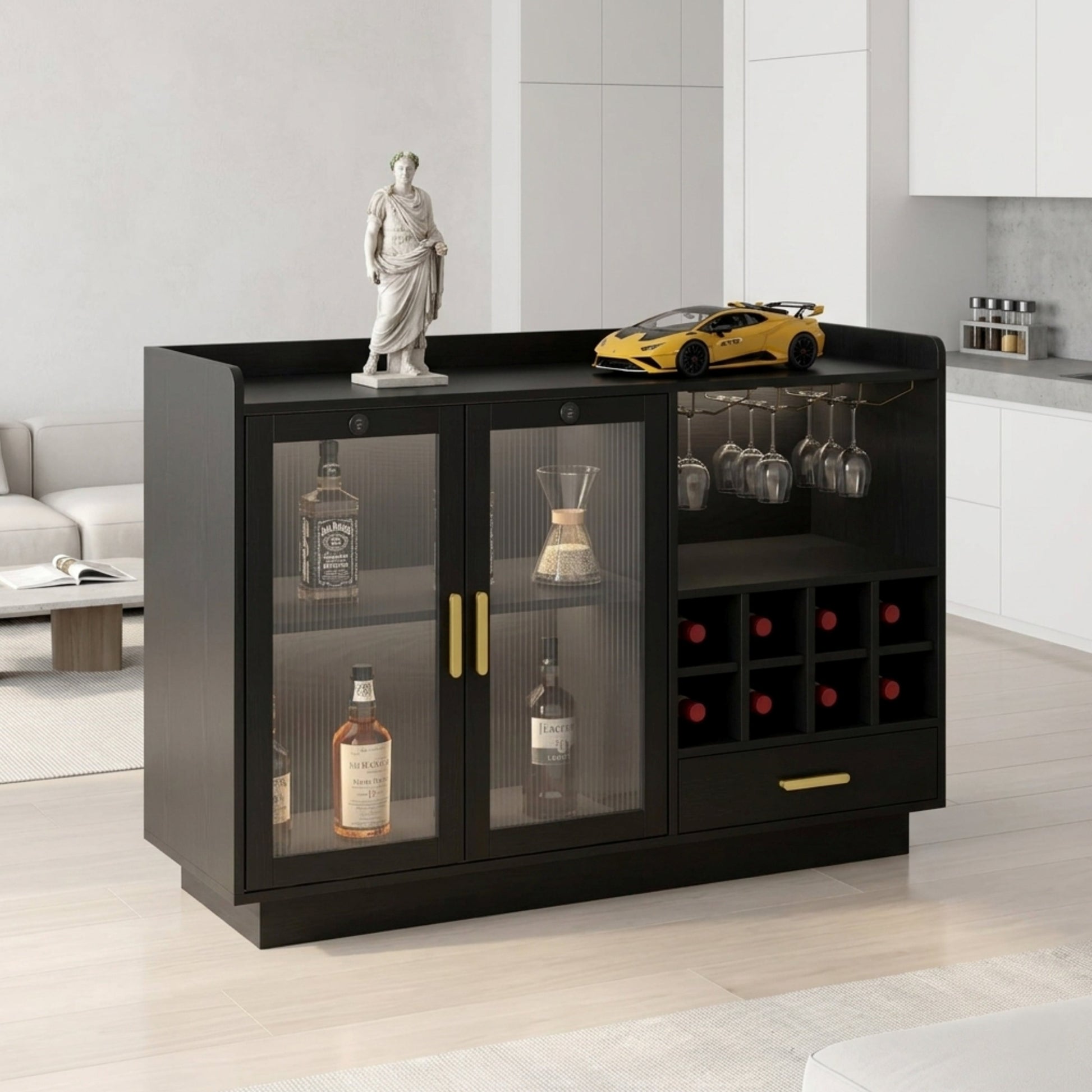 Black bar cabinet with glass doors displaying bottles and wine glasses in a modern living room.