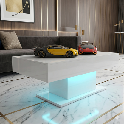 Modern living room with a white coffee table featuring model cars, gray sofa, and decorative wall art.